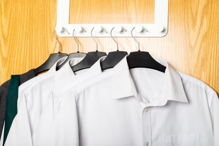 White shirts hanging on coat-hangers White shirts hanging on coat-hangers