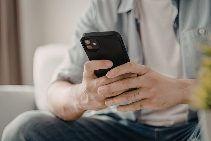 Person holding mobile phone